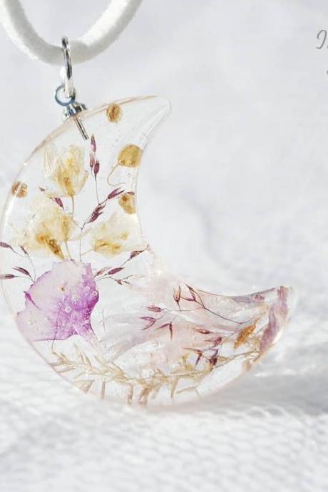 Pink plant shades crescent shaped resin pendant necklace